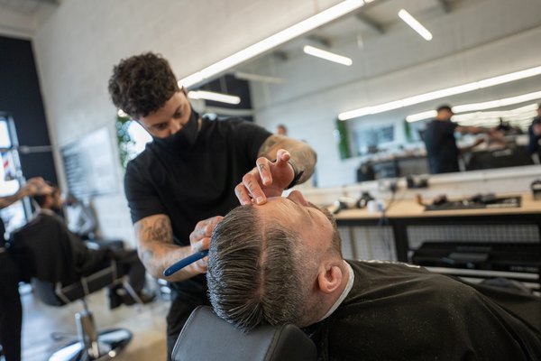 Man getting hair cut at Rascal's barbers